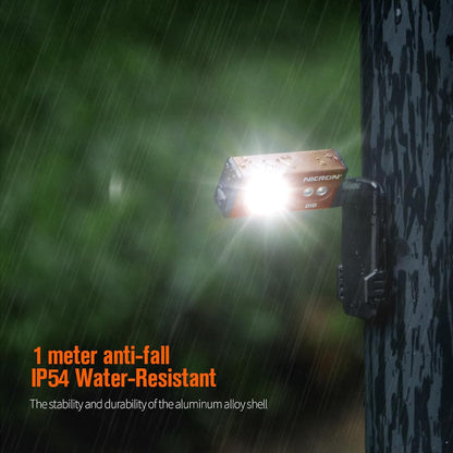 APEX Online SA NICRON D10 orange EDC flashlight mounted magnetically to a wet tree trunk in the rain